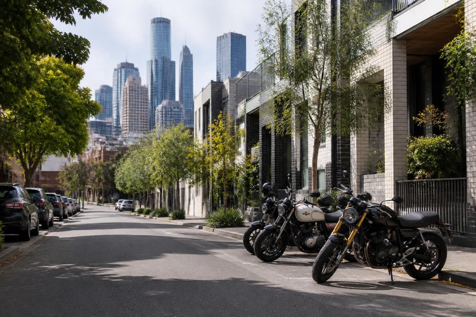 Melbourne street scene with parked motorcycles and modern buildings.